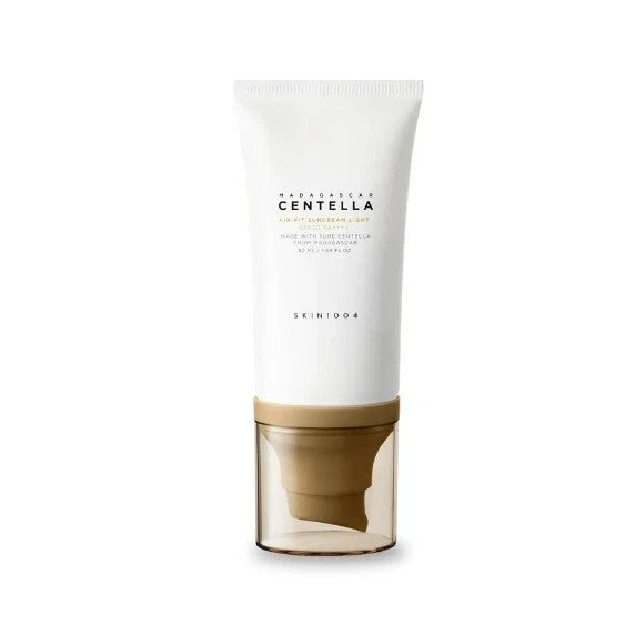 Skincare product with white cap and beige base on a white background